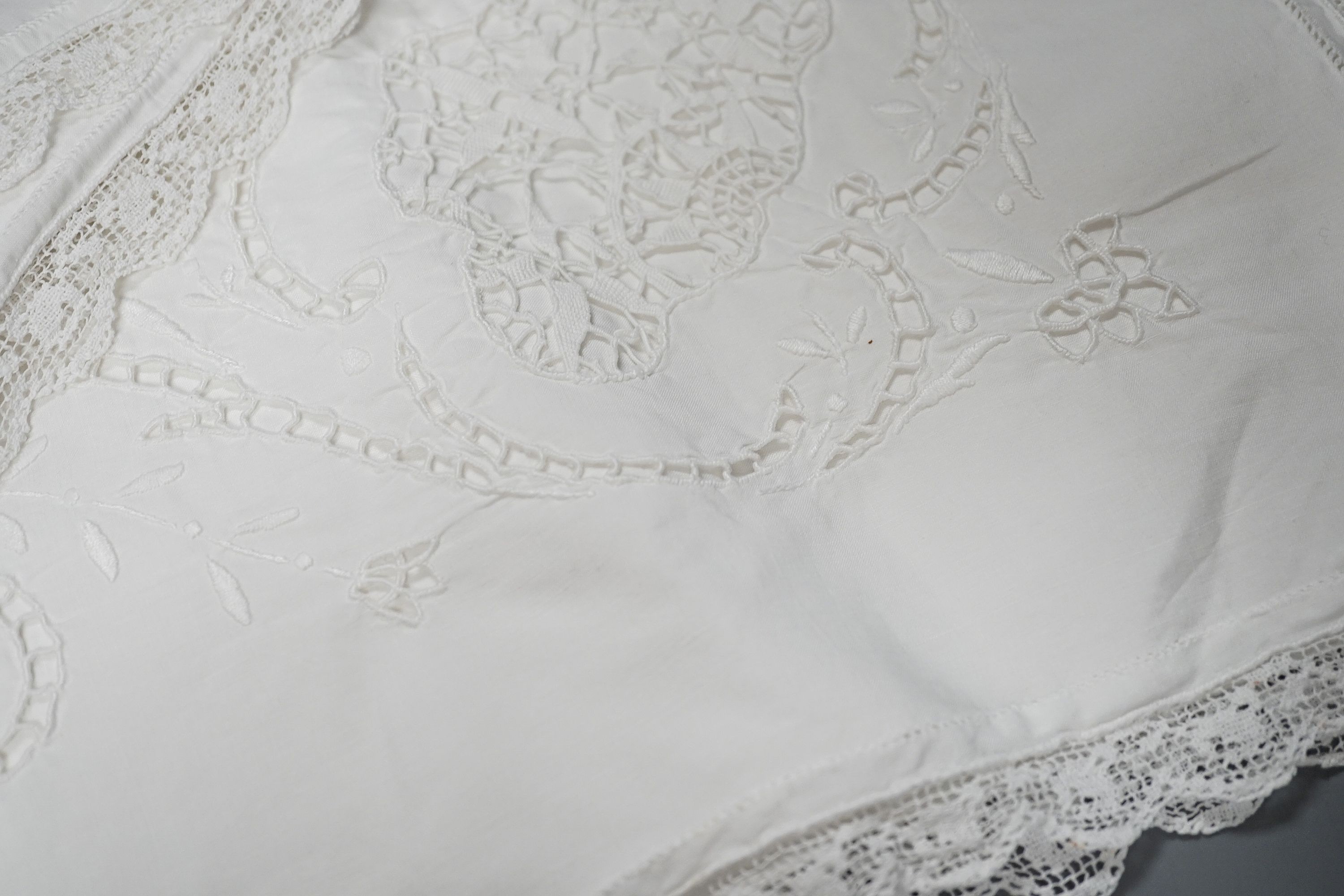 A pair of cutwork and filet pillow cases, two christening gowns, crochet cloth etc